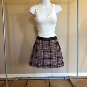 Plaid skirt with leather trim. So cute!!